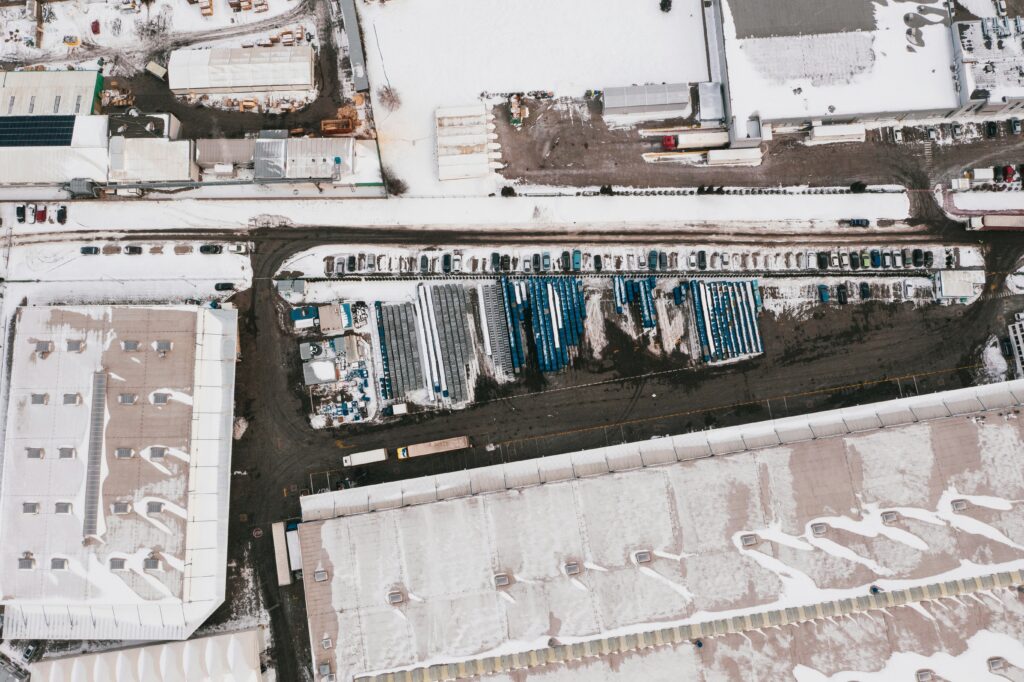 a snow-covered industrial facility